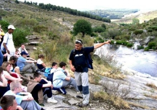 By the river. 